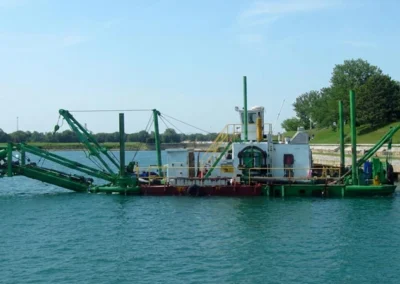 Cutter suction dredger excavating and removing sediment from the seabed or riverbed