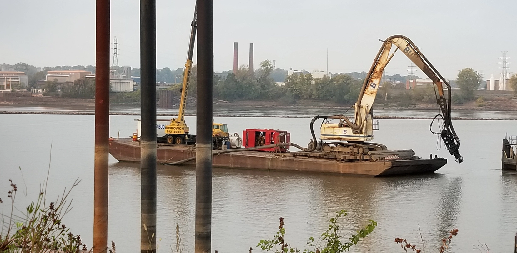 Budrovich banner1 Budrovich excavator dredge pump attachment dredging the Mississippi River near Granite City, Illinois