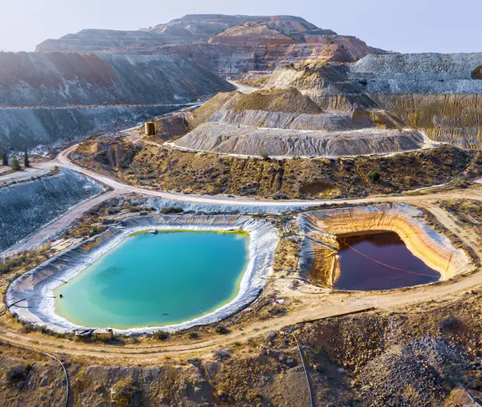 Open-pit mine with settling and tailings ponds Open-pit mine with settling and tailings ponds for mineral slurry handling