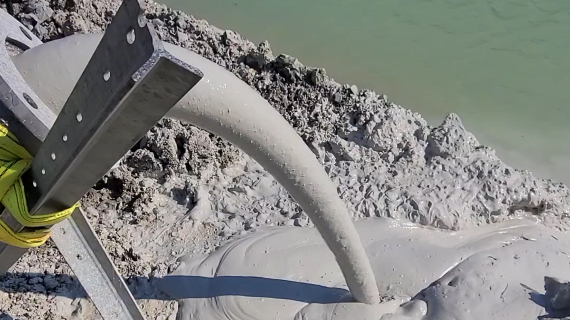 EDDY Pump Discharging sludge at Construction Site EDDY Pump discharging a thick sludge from a black pipe