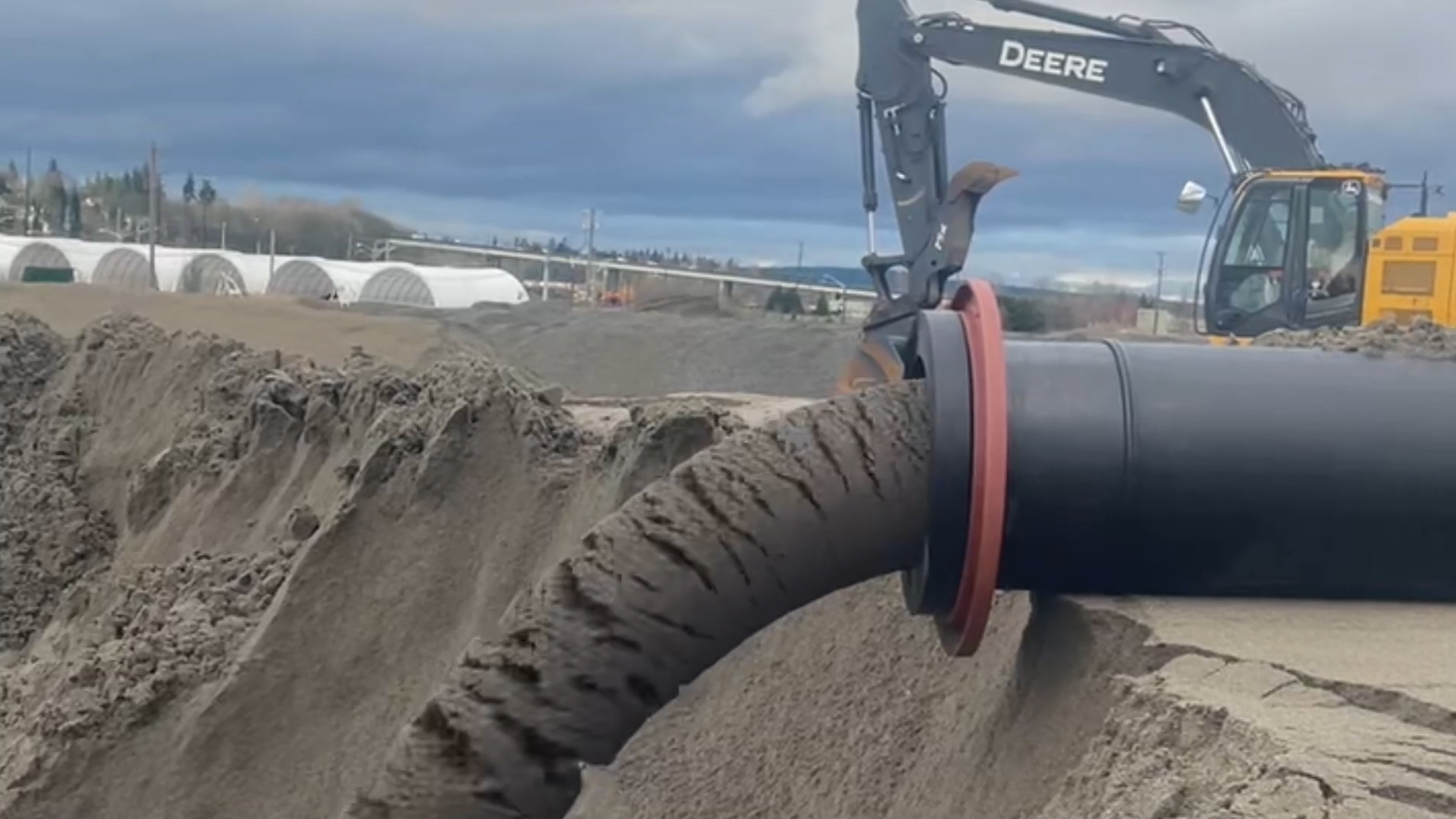 DDY Pump Discharging Slurry Material at a Work Site EDDY Pump discharging slurry into a muddy area