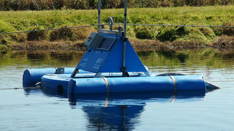 lagoon dredge equipment on surface of lagoon