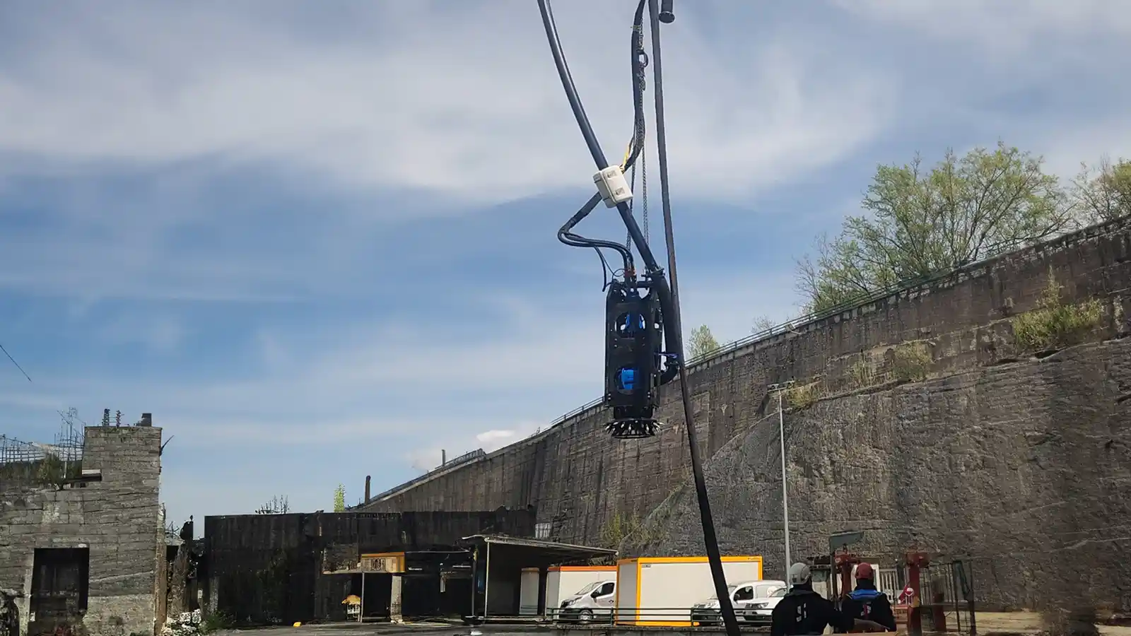 Pump deployment reaching into a barge hold for dredging