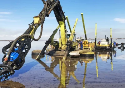 EDDY Pump excavator pump attachment performing reliable dredging in shallow water, best US manufactured sediment removal equipment for sale