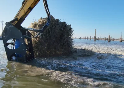 Reliable excavator-mounted dredge pump removing debris and vegetation from waterways, efficient sediment management equipment in the USA